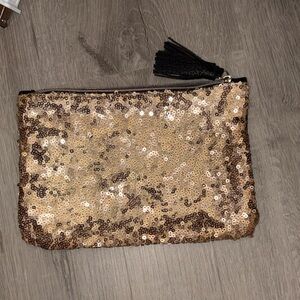 ipsy Gold Sequin Clutch with Black Tassel